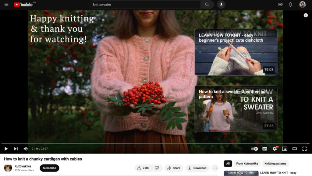end card on a knitting video, showing a woman in the finished pink sweater, as well as end cards linking to a beginner knitting project and a pdf pattern.